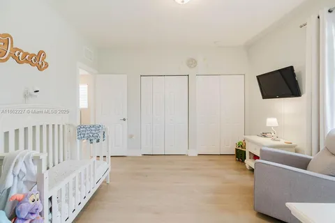 a view of a bedroom with furniture