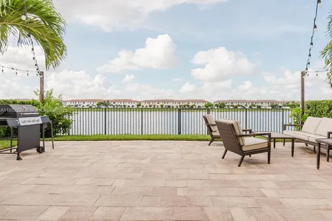a view of a lake with furniture