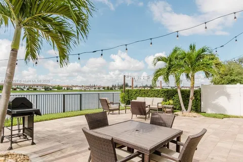 a view of a terrace with furniture and a potted plant