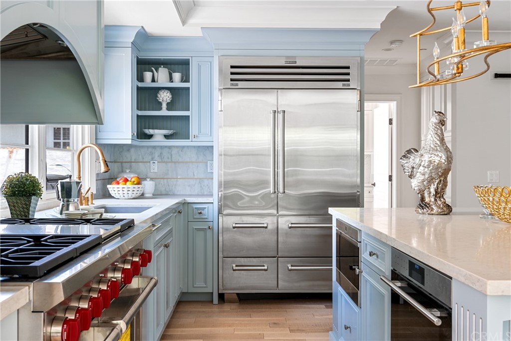 2159 Lorain Road San Marino, CA 91108 - Photo 12 of 42 a kitchen with stainless steel appliances a sink stove and cabinets