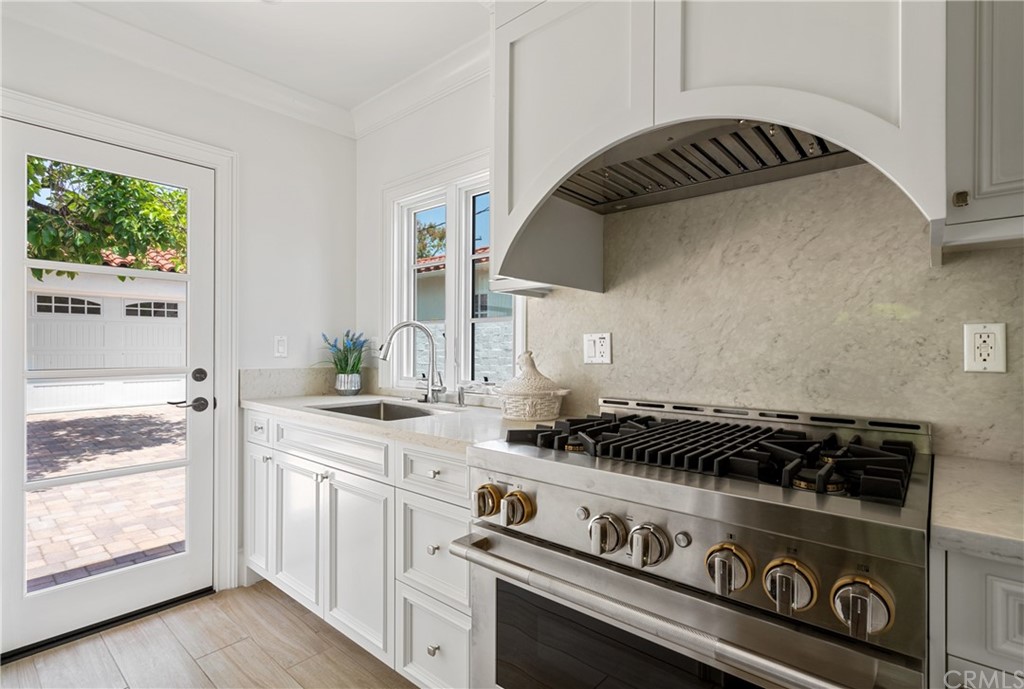2159 Lorain Road San Marino, CA 91108 - Photo 18 of 42 a kitchen with a stove and a white cabinets