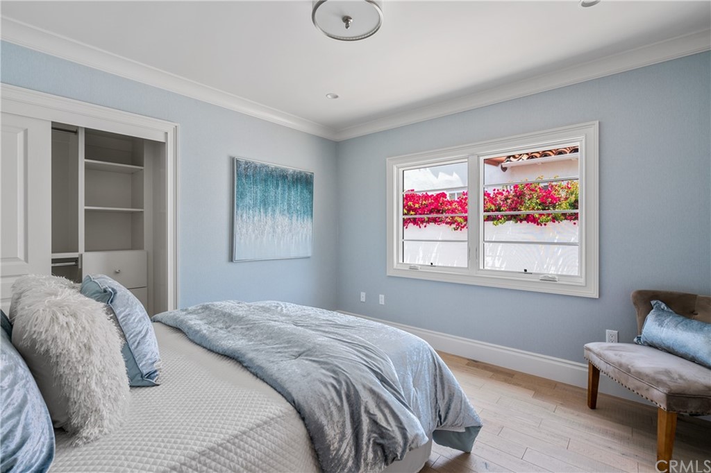 2159 Lorain Road San Marino, CA 91108 - Photo 21 of 42 a bedroom with a bed and glass window