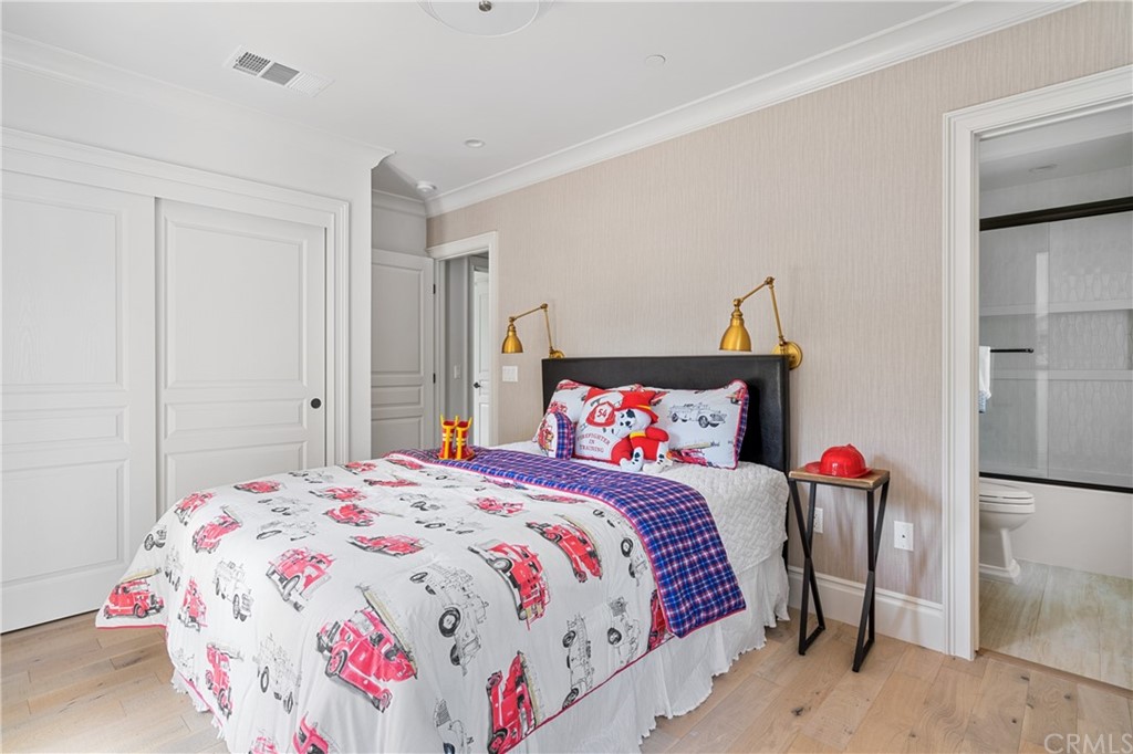 2159 Lorain Road San Marino, CA 91108 - Photo 32 of 42 a bedroom with a bed and a chandelier