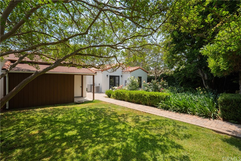 2159 Lorain Road San Marino, CA 91108 - Photo 35 of 42 a front view of a house with a yard and garage