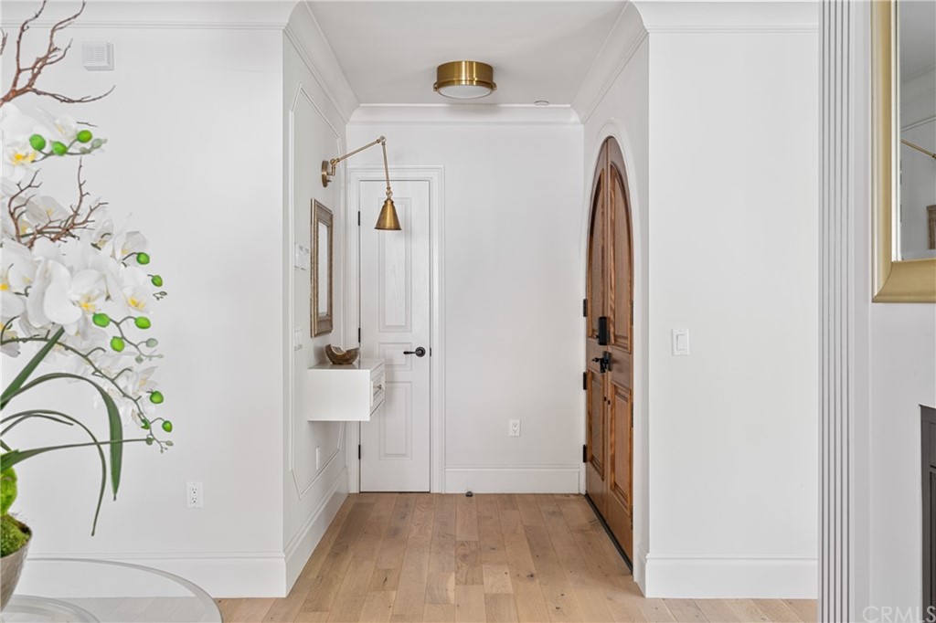 2159 Lorain Road San Marino, CA 91108 - Photo 6 of 42 a view of a hallway with wooden floor and door