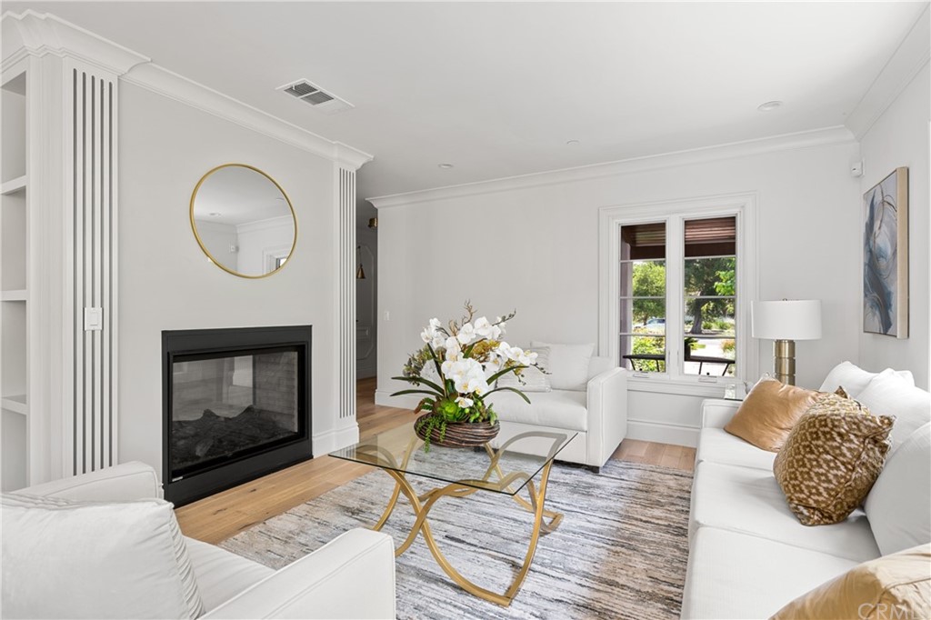 2159 Lorain Road San Marino, CA 91108 - Photo 9 of 42 a living room with furniture and a fireplace