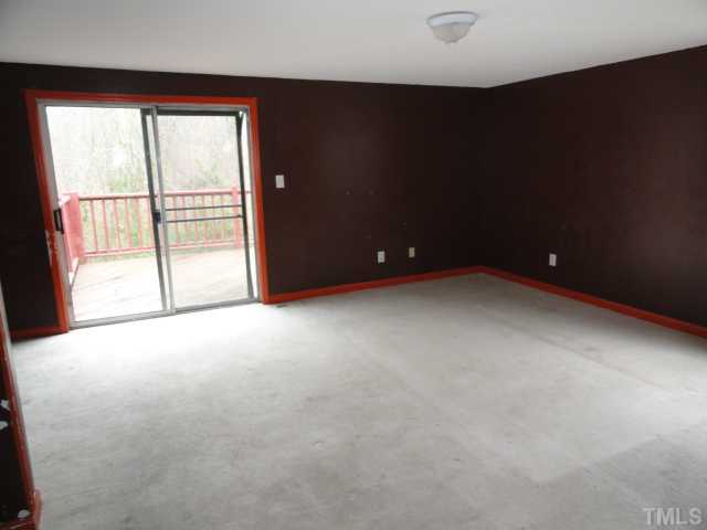 1130 Villa Green Court Raleigh, NC 27612 - Photo 4 of 9 an empty room with windows