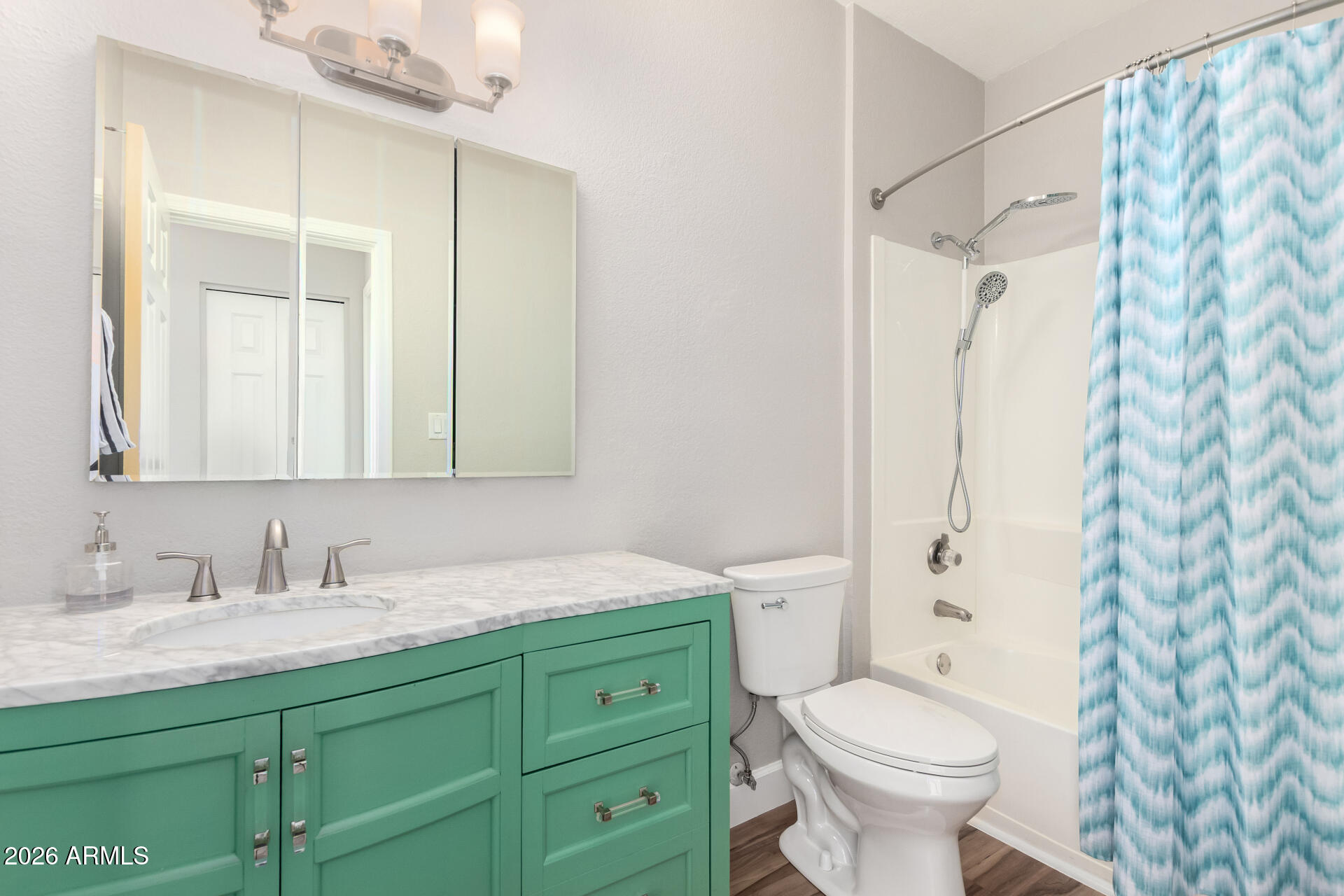 100 East Fillmore Street, Unit 119 Phoenix, AZ 85004 - Photo 19 of 34 a bathroom with a granite countertop sink toilet and shower