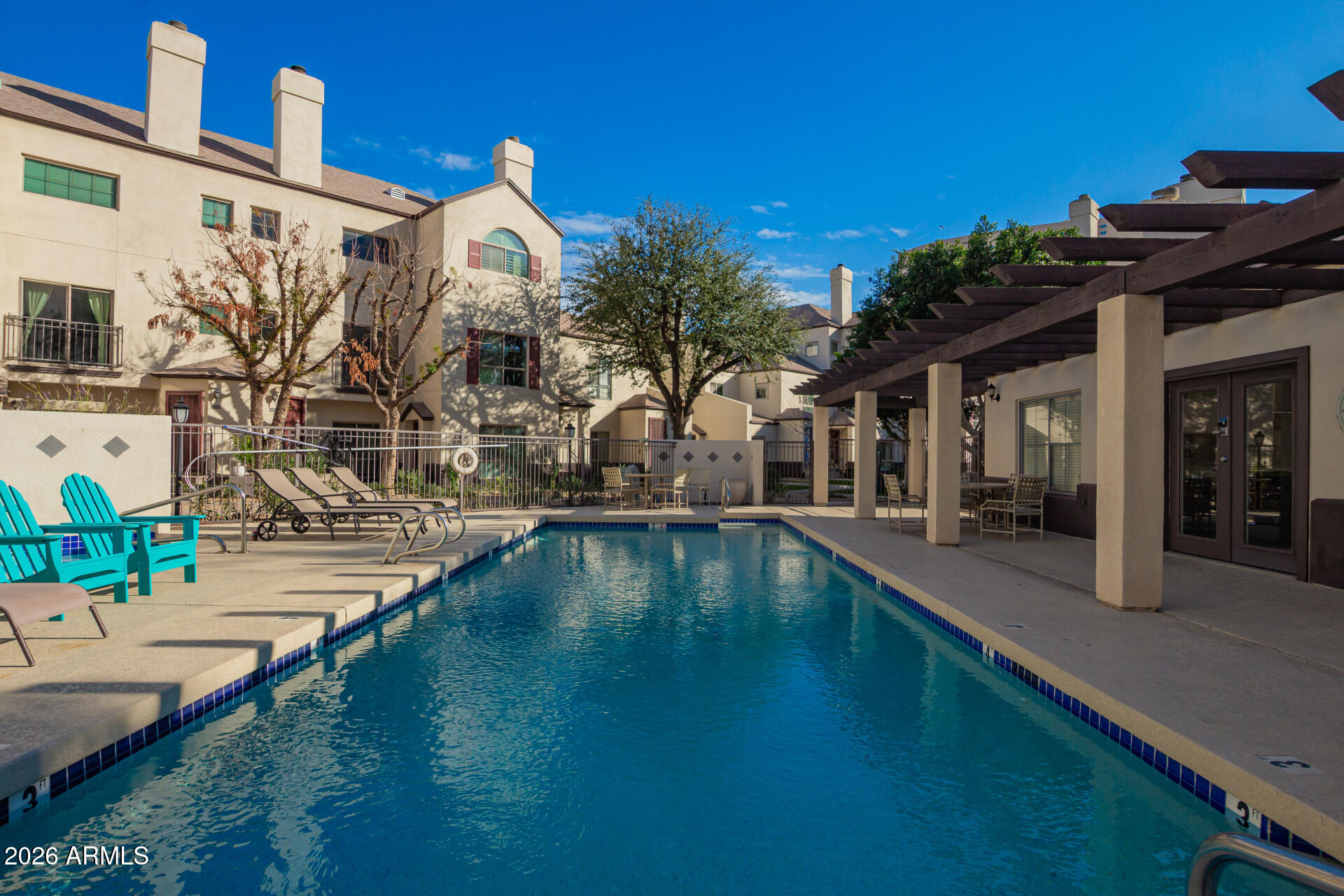 100 East Fillmore Street, Unit 119 Phoenix, AZ 85004 - Photo 28 of 34 a view of a house with a swimming pool