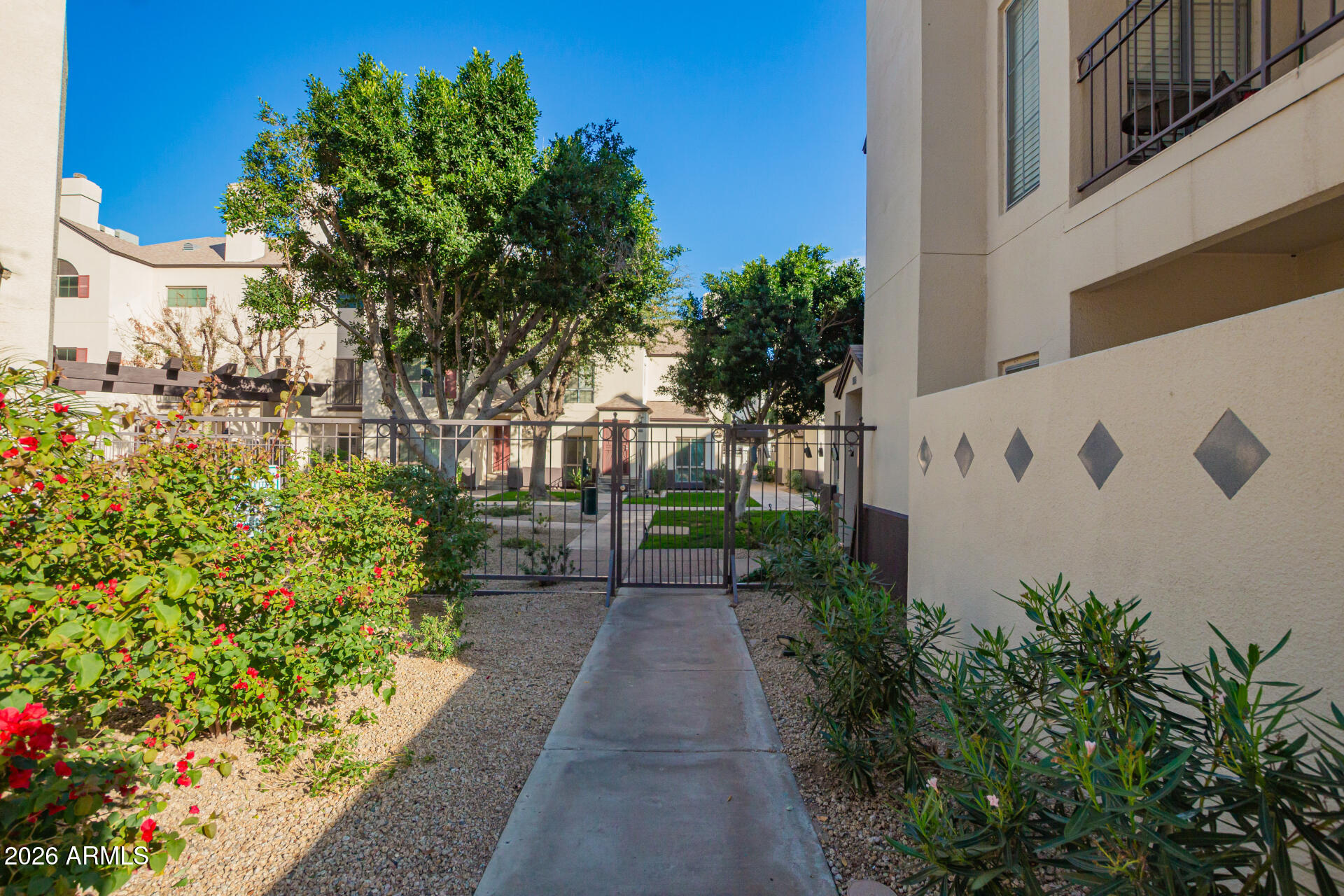 100 East Fillmore Street, Unit 119 Phoenix, AZ 85004 - Photo 30 of 34 a view of a pathway with house on both side