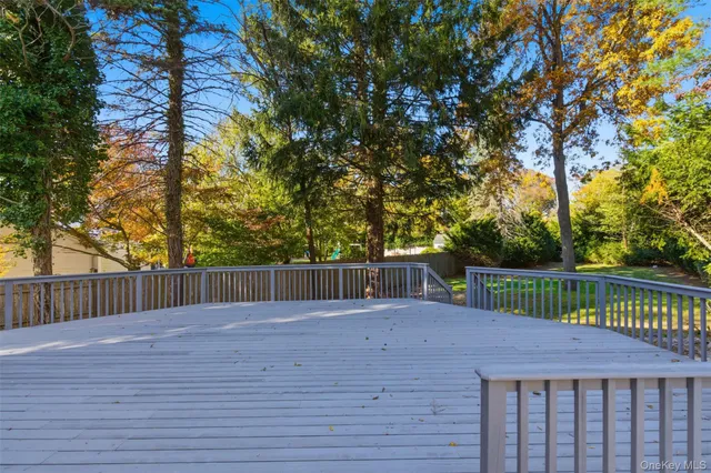 a balcony with wooden floor