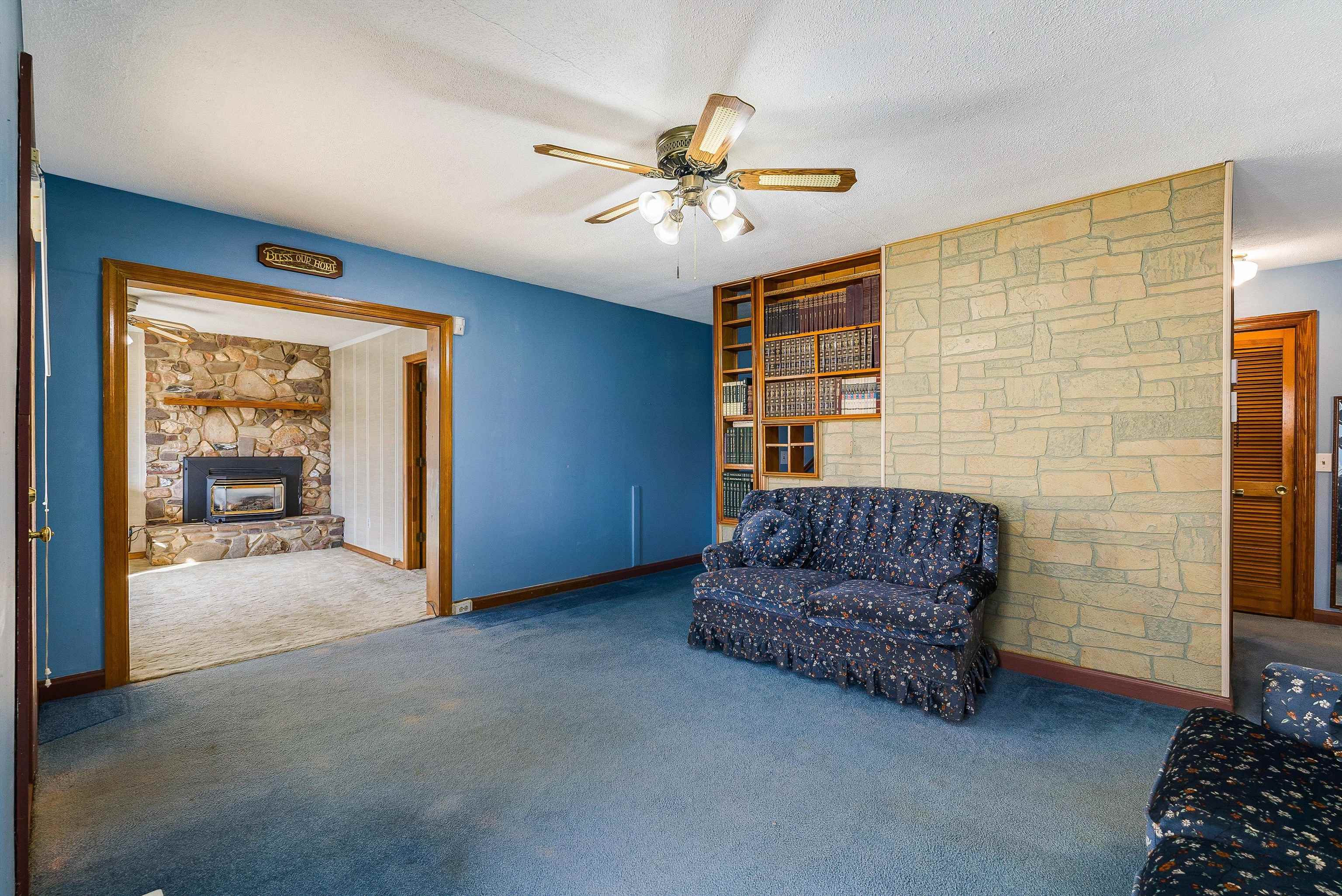 18753 Mt Pleasant Road Elkton, VA 22827 - Photo 12 of 34 a living room with furniture and a ceiling fan
