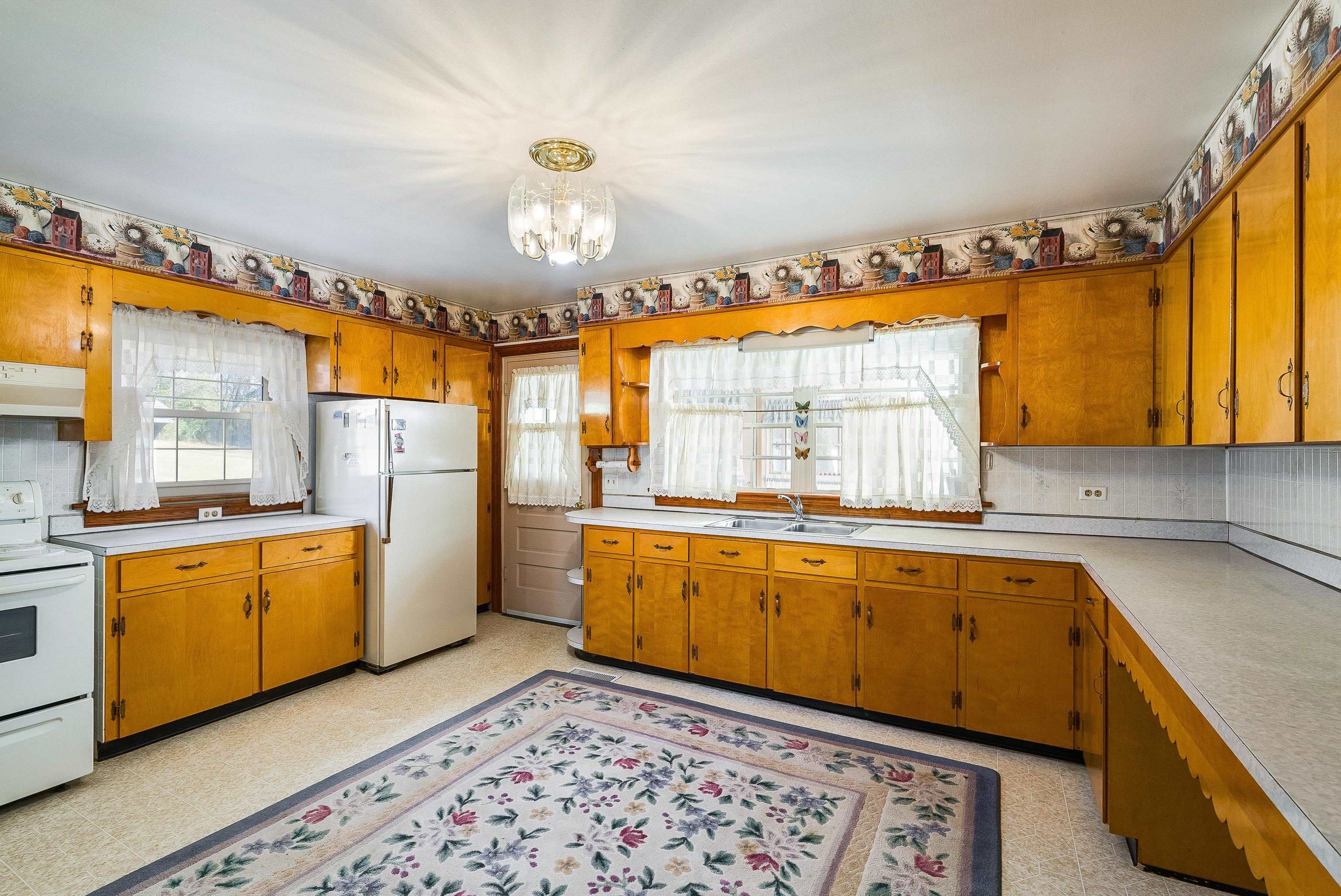 18753 Mt Pleasant Road Elkton, VA 22827 - Photo 17 of 34 a large kitchen with stainless steel appliances granite countertop a sink and cabinets