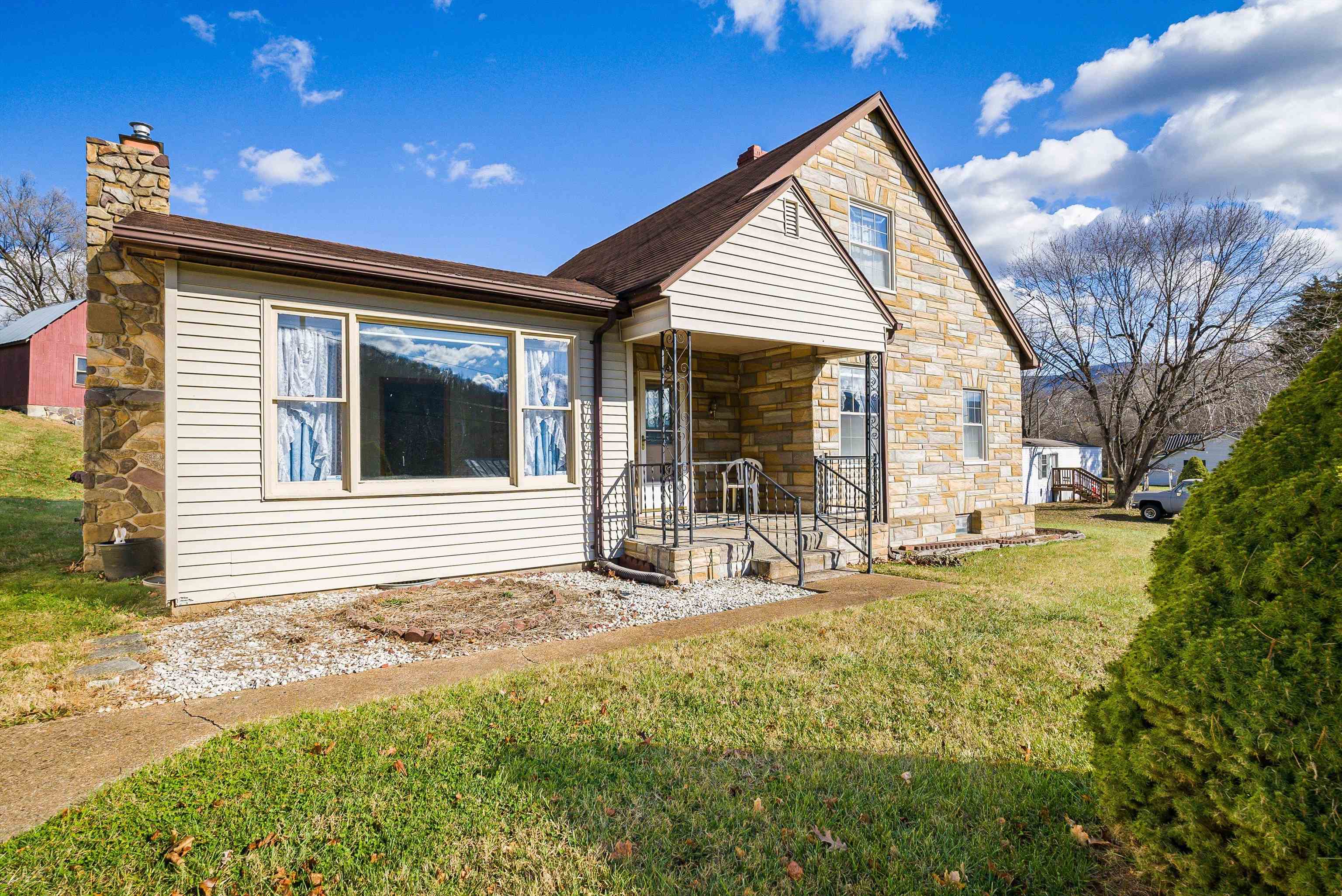 18753 Mt Pleasant Road Elkton, VA 22827 - Photo 6 of 34 a backyard of a house with table and chairs