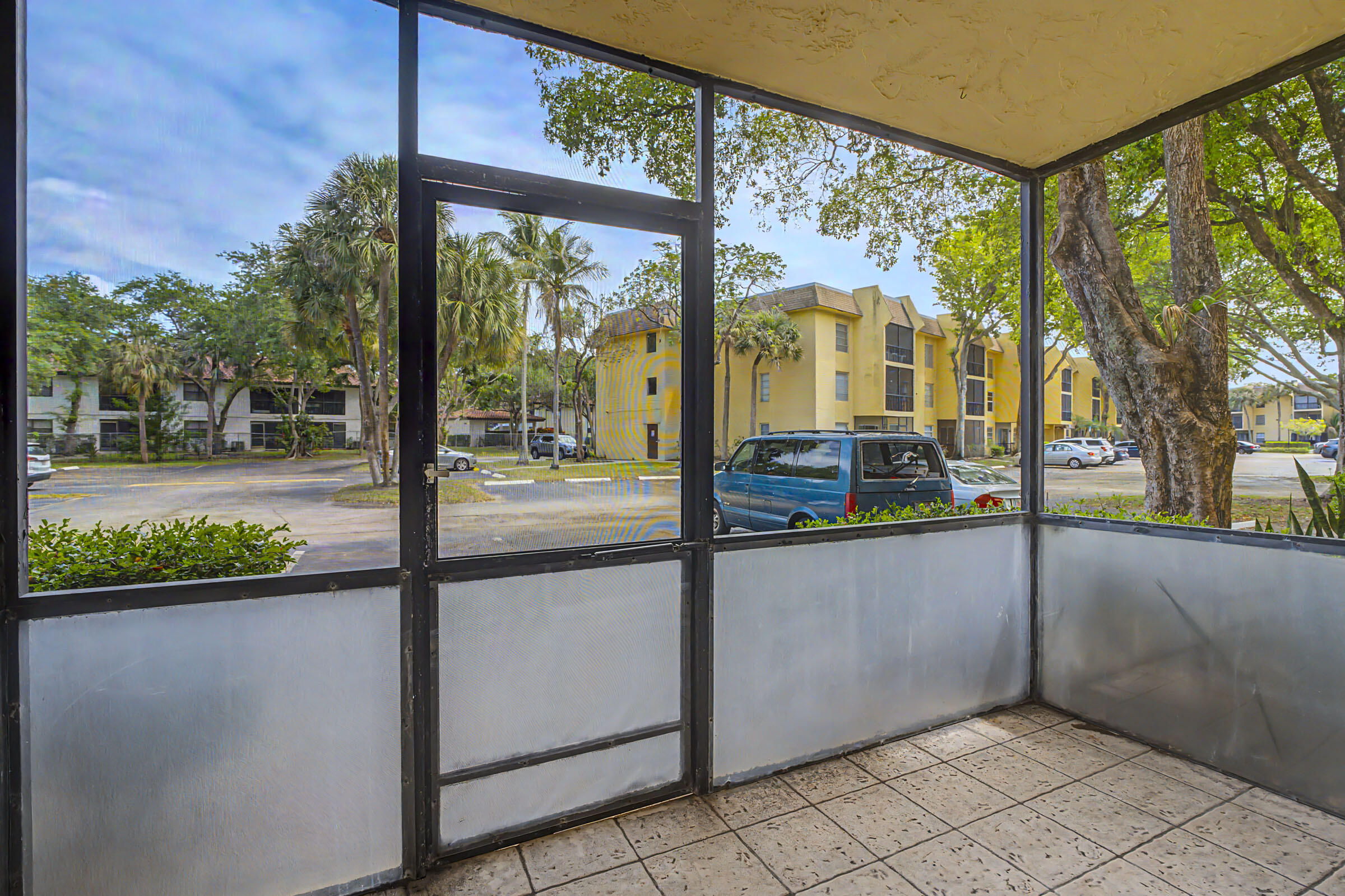 490 Northwest 20th Street, Unit 1030 Boca Raton, FL 33431 - Photo 13 of 18 Screen Patio with Parking Access