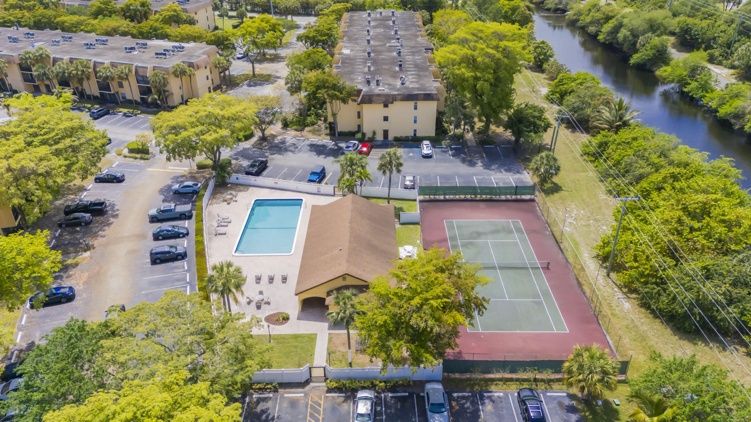 490 Northwest 20th Street, Unit 1030 Boca Raton, FL 33431 - Photo 14 of 18 Club House with Pool and Tennis Courts