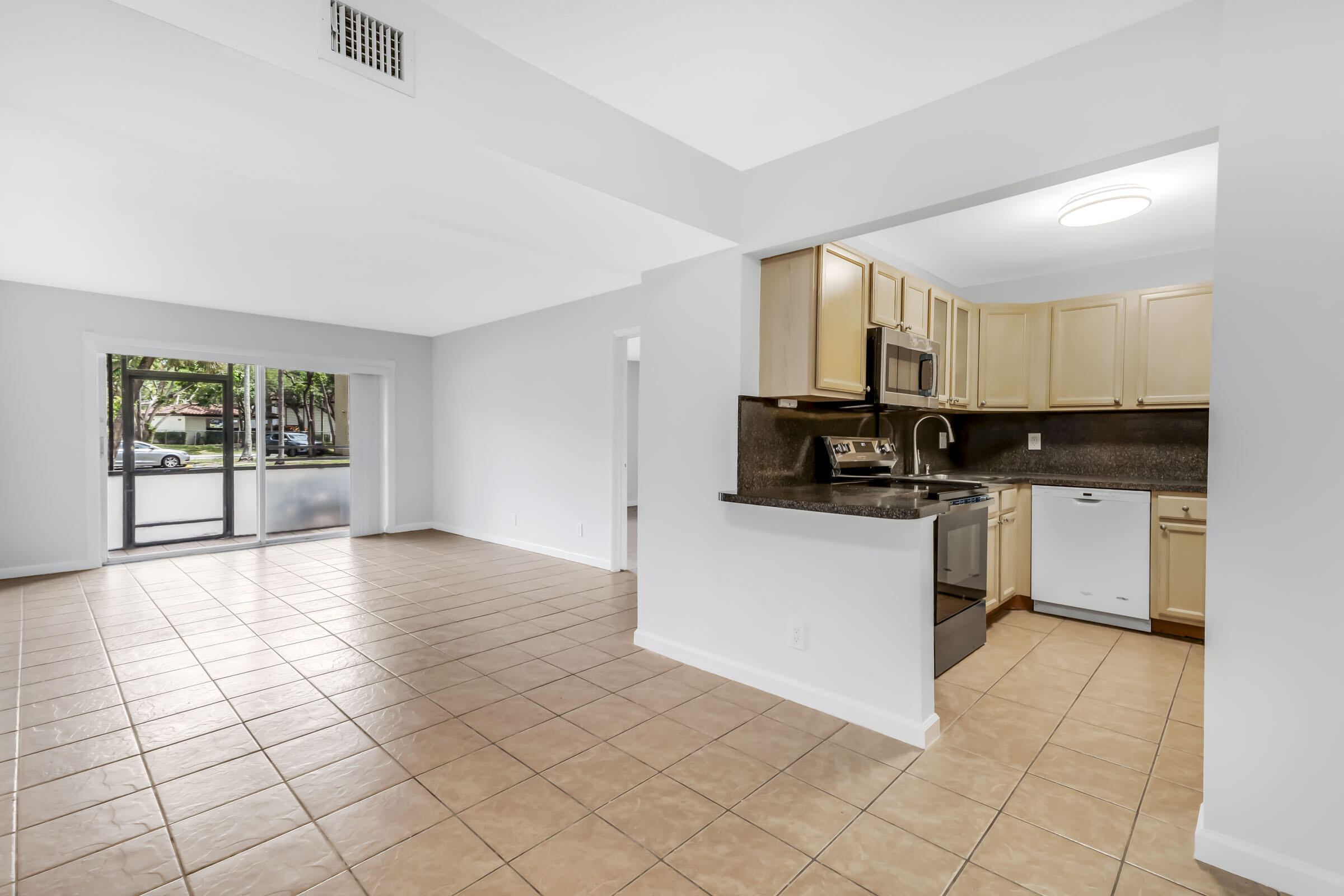 490 Northwest 20th Street, Unit 1030 Boca Raton, FL 33431 - Photo 2 of 18 Living Room & Kitchen