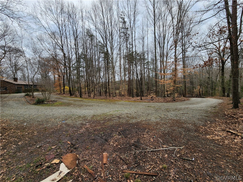 2520 Old Tavern Road Powhatan, VA 23139 - Photo 5 of 42 Driveway opens up and splits into a circular parking area with additional parking closer to the house.