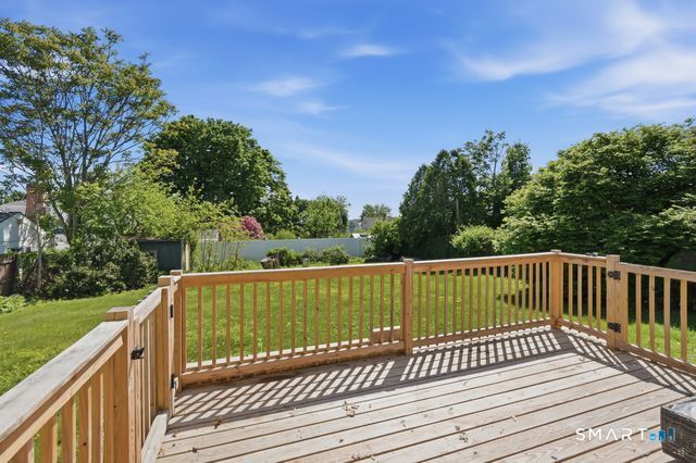 443 Highland Avenue Waterbury, CT 06708 - Photo 22 of 24 a view of balcony with wooden floor and fence