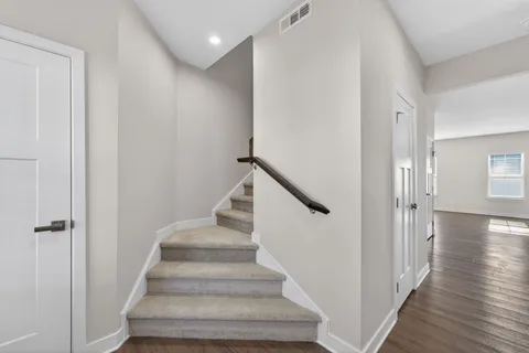 a view of an entryway with wooden floor