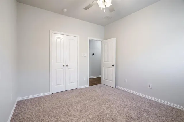 an empty room with a bathroom