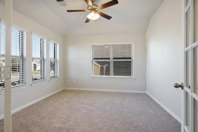 a view of an empty room with a window