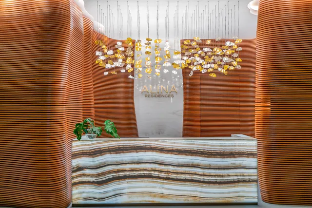 a living room with furniture and large windows