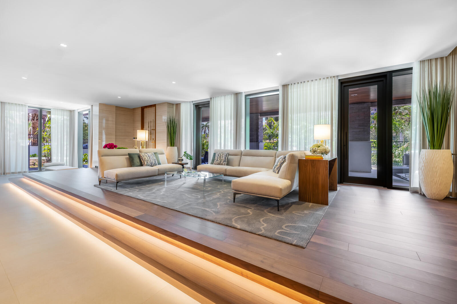 200 Southeast Mizner Boulevard, Unit 106 Boca Raton, FL 33432 - Photo 23 of 43 a living room with furniture and large windows
