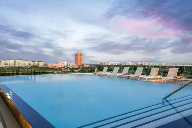 a bathroom with a tub and shower curtain