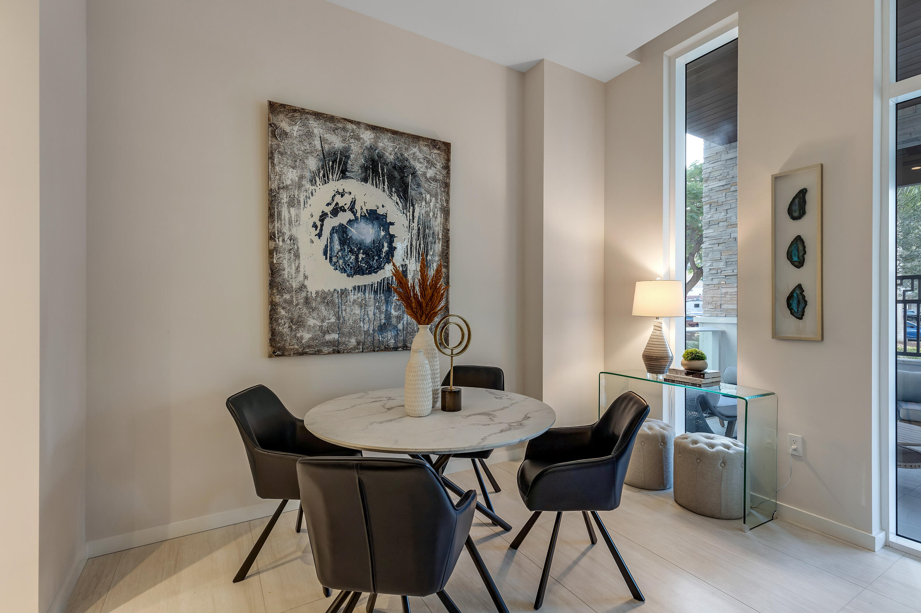 200 Southeast Mizner Boulevard, Unit 106 Boca Raton, FL 33432 - Photo 6 of 43 a view of a dining room with furniture and wooden floor