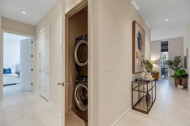 a view of a hallway with washer and dryer