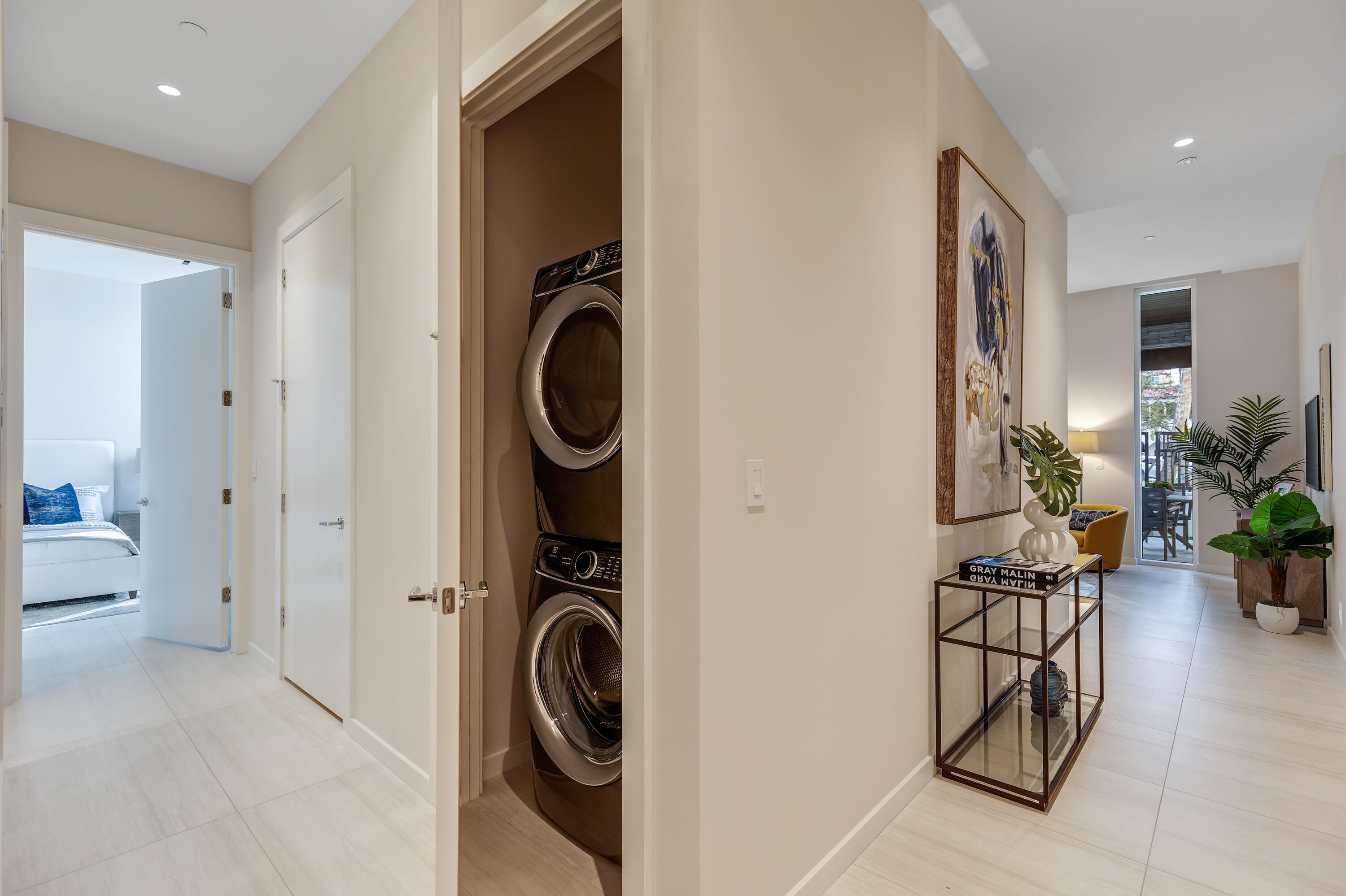 200 Southeast Mizner Boulevard, Unit 106 Boca Raton, FL 33432 - Photo 10 of 43 a view of a hallway with washer and dryer