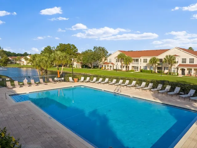 a view of a lake with a houses in the background