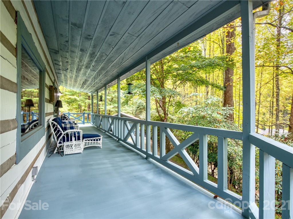 1052 Springbrook Farm Road Waynesville, NC 28786 - Photo 3 of 37 a dining room with furniture water view and a outdoor space