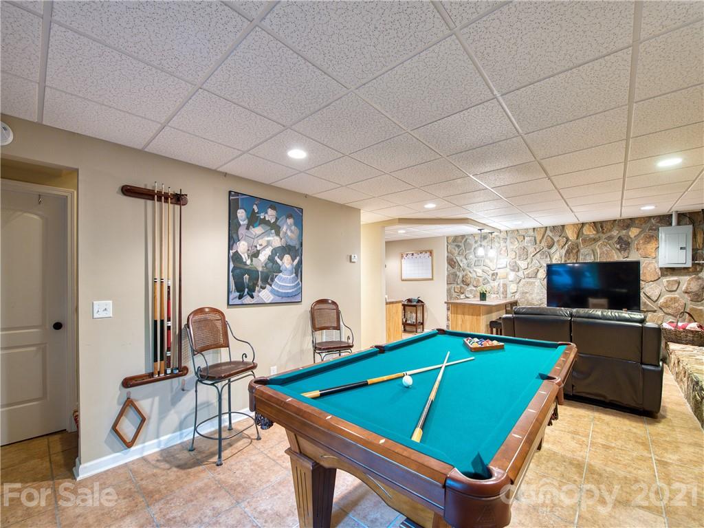 1052 Springbrook Farm Road Waynesville, NC 28786 - Photo 23 of 37 a room with furniture pool table and windows
