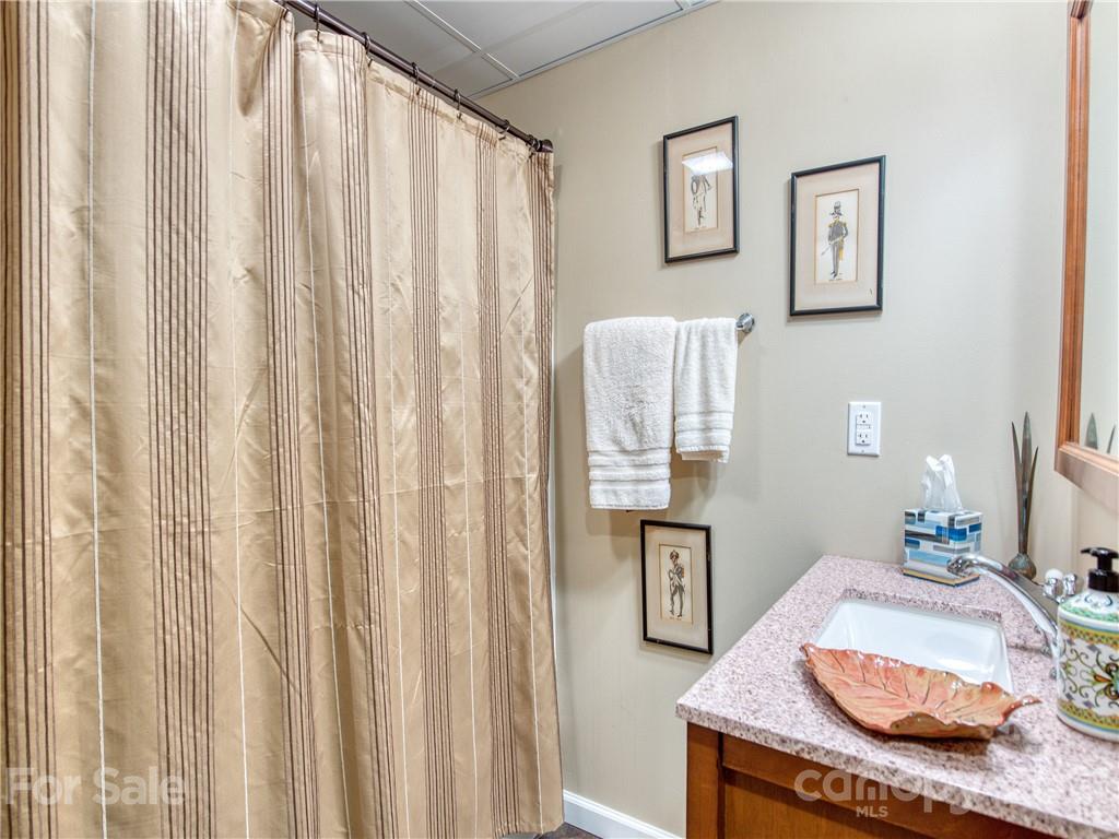1052 Springbrook Farm Road Waynesville, NC 28786 - Photo 31 of 37 a bedroom with a bed and a furniture