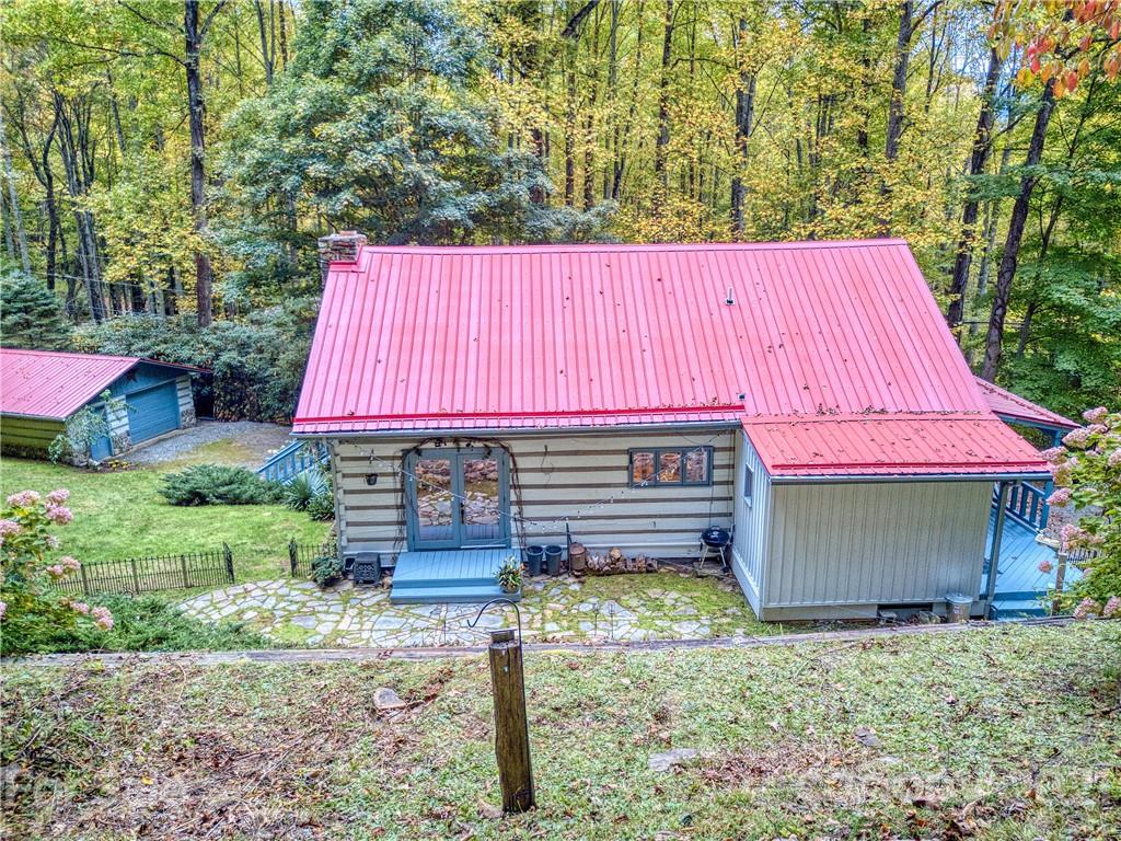 1052 Springbrook Farm Road Waynesville, NC 28786 - Photo 35 of 37 a view of a house with a backyard