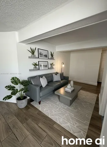 a living room with furniture and flowers