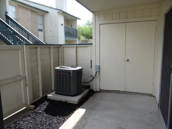 a view of a hallway with washer and dryer