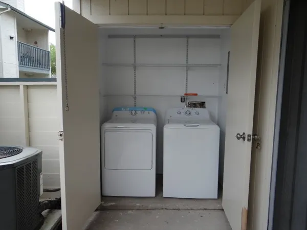 a utility room with dryer and washer