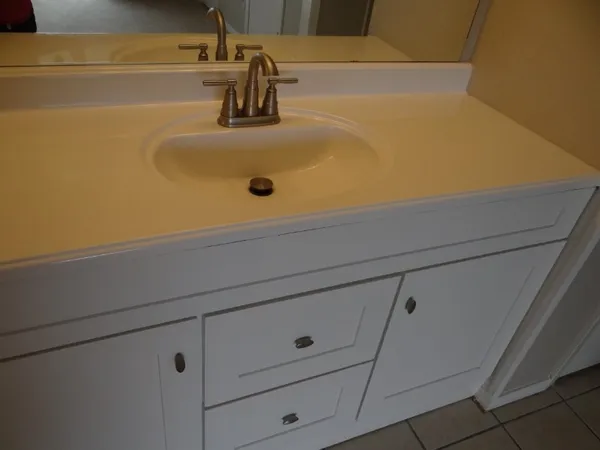 a bathroom with a sink and vanity