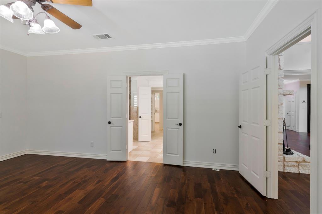 1980 Gertie Barrett Road Mansfield, TX 76063 - Photo 14 of 40 a view of an empty room with wooden floor and a window
