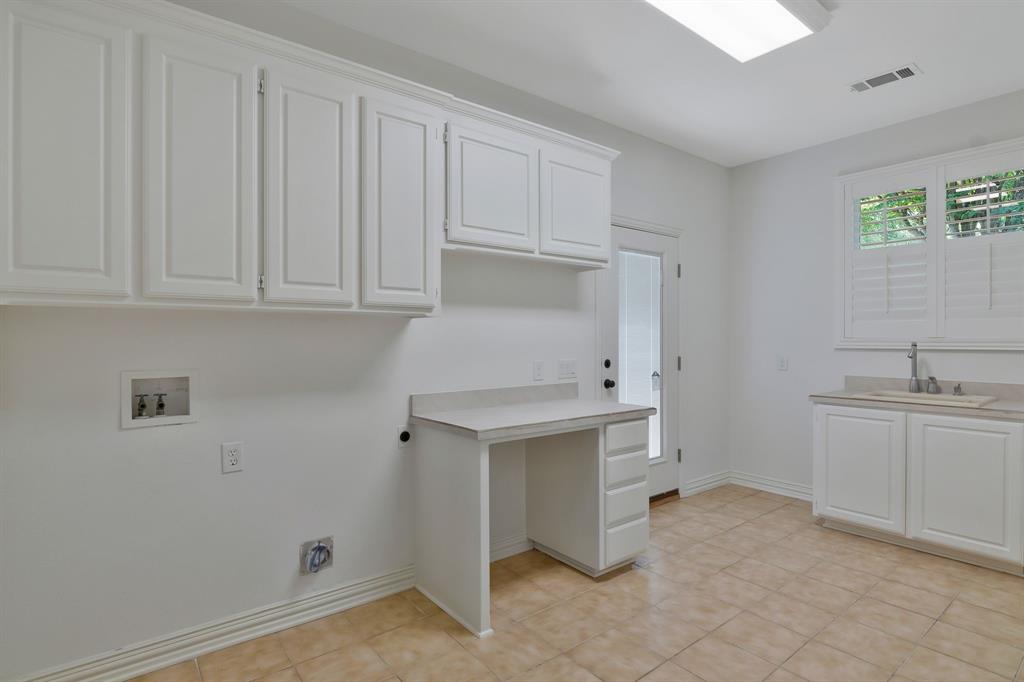 1980 Gertie Barrett Road Mansfield, TX 76063 - Photo 18 of 40 a kitchen with sink cabinets and stove