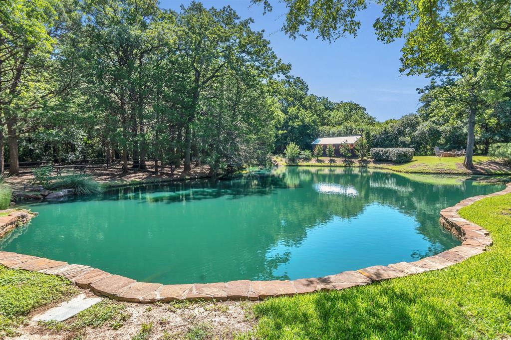 1980 Gertie Barrett Road Mansfield, TX 76063 - Photo 29 of 40 a view of a lake with a house in the background