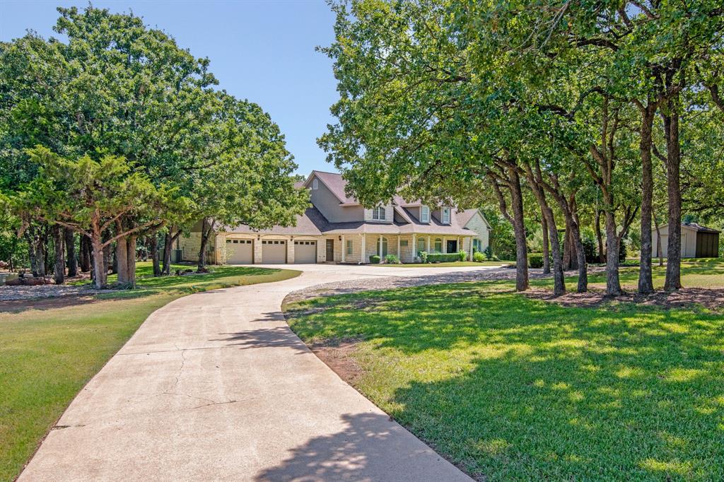 1980 Gertie Barrett Road Mansfield, TX 76063 - Photo 3 of 40 a front view of a house with a garden