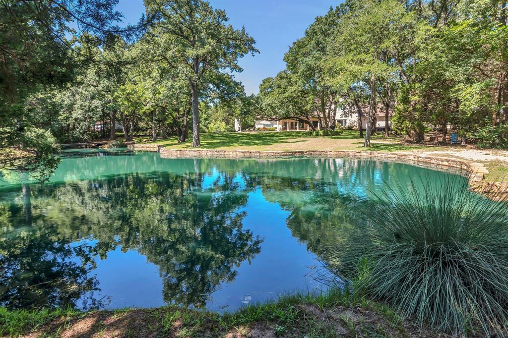 1980 Gertie Barrett Road Mansfield, TX 76063 - Photo 32 of 40 a view of a lake with a yard and large trees