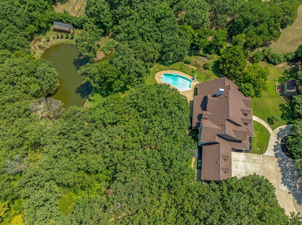 1980 Gertie Barrett Road Mansfield, TX 76063 - Photo 36 of 40 an aerial view of a house with a garden and trees