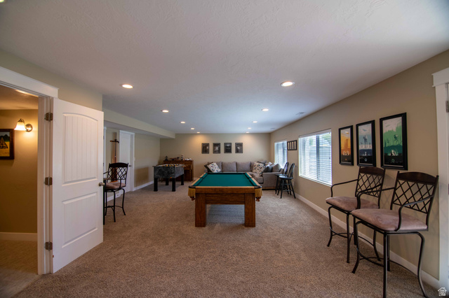 646 East 1400th Street North Mapleton, UT 84664 - Photo 41 of 78 Spacious recreation room featuring carpet flooring, recessed lighting, white trim, and multiple windows with blinds