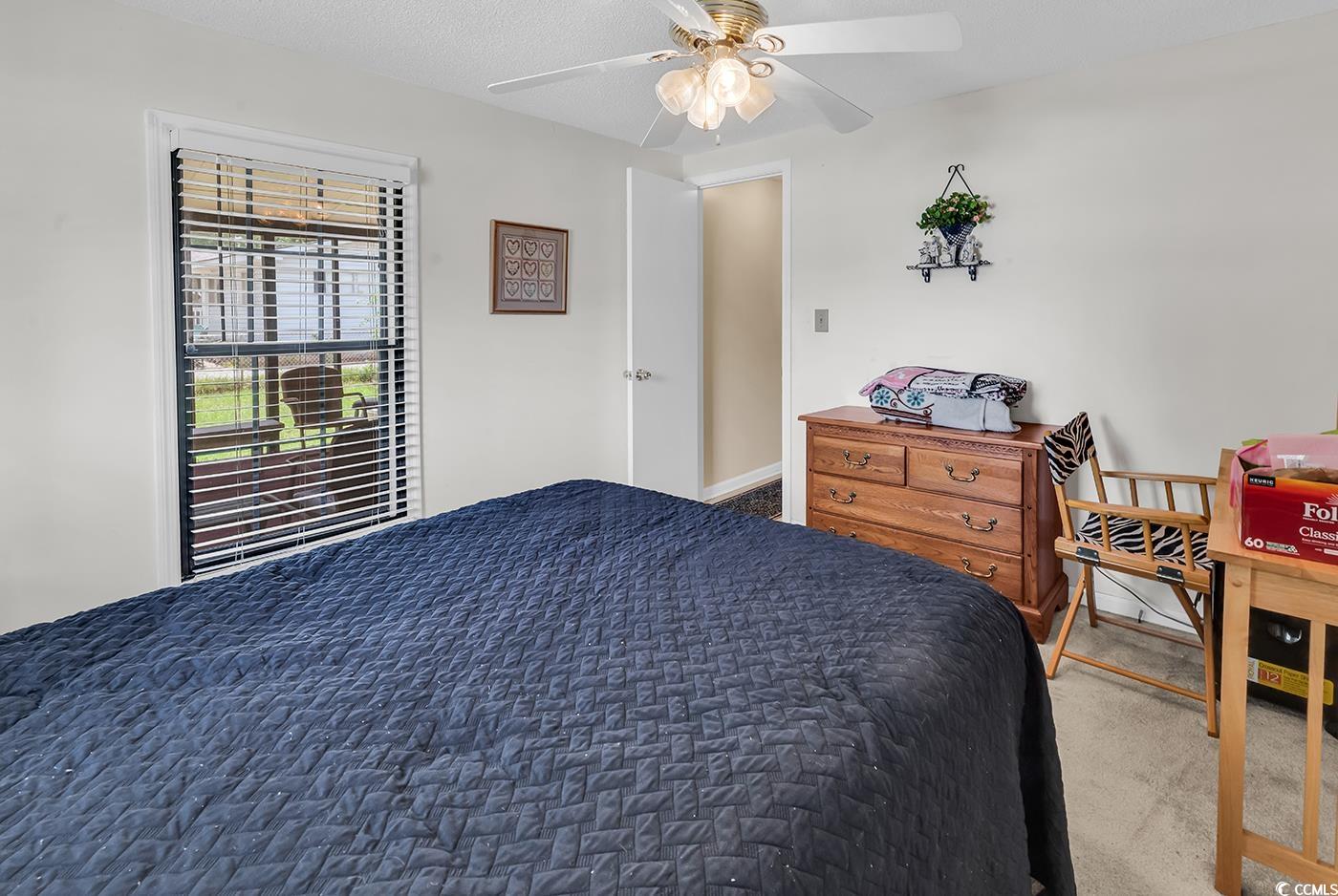 449 Rainbow Drive Murrells Inlet, SC 29576 - Photo 10 of 33 Carpeted bedroom featuring a ceiling fan
