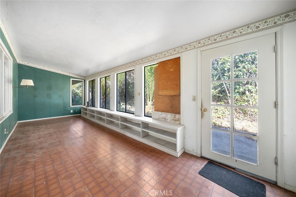 1178 San Carlos Drive San Luis Obispo, CA 93401 - Photo 10 of 32 a view of an empty room with wooden floor and a window